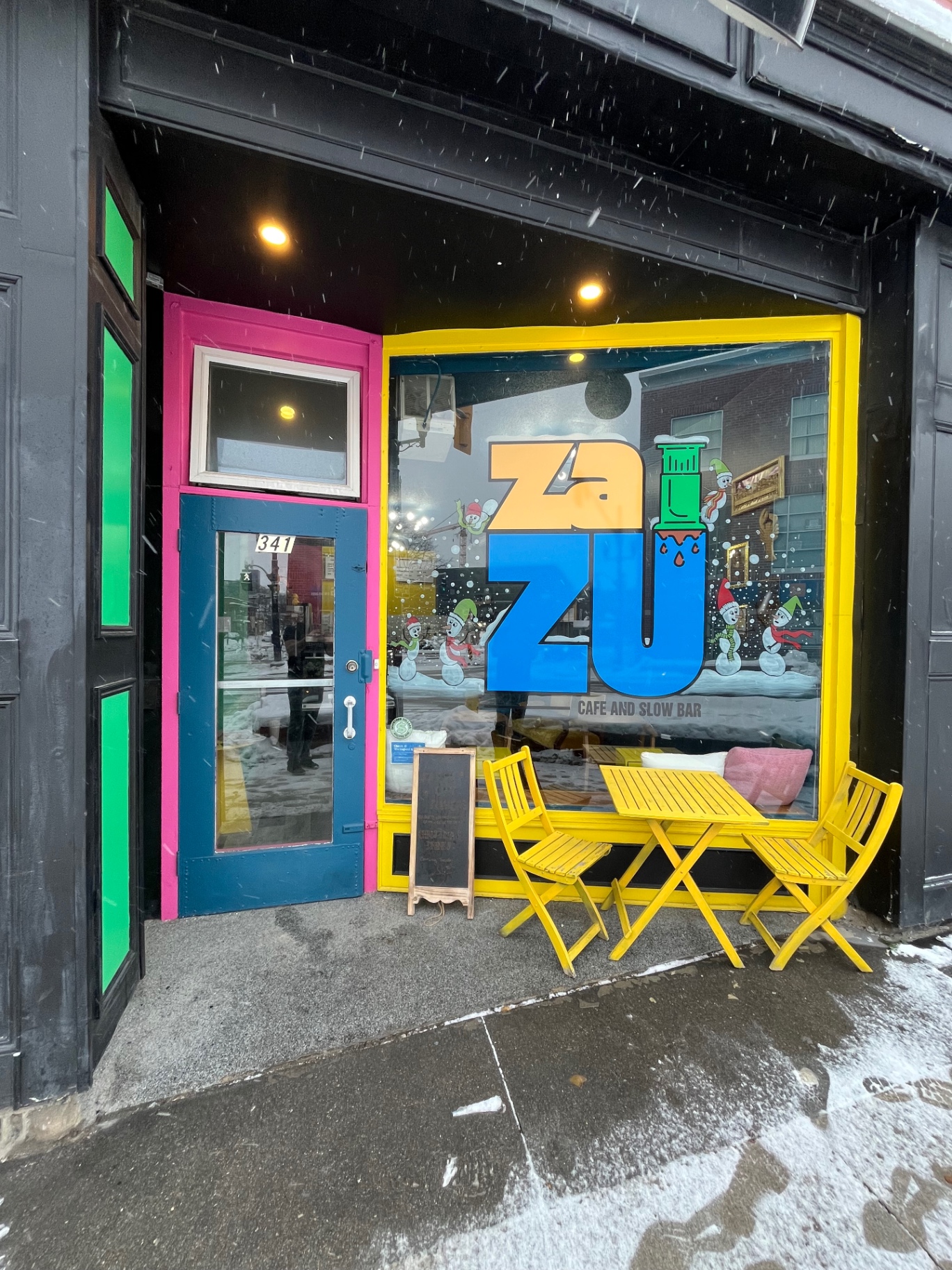Zazu Café storefront at 341 King St E with hot pink door, yellow window frame and neon green panels