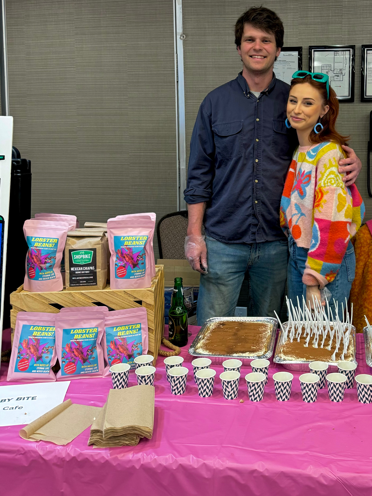 Zazu's Lobster Beans! coffee bags at a pop-up with tiramisu and pink table cloth